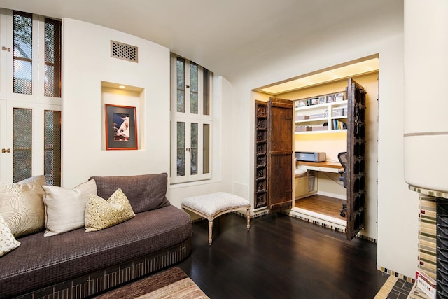 sitting room featuring wood finished floors and visible vents