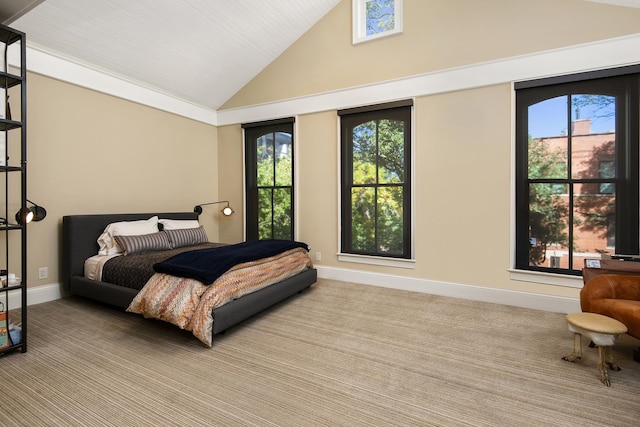 bedroom featuring baseboards, high vaulted ceiling, and carpet flooring