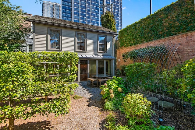 rear view of property with a patio