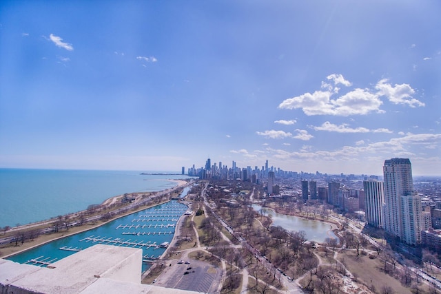 bird's eye view featuring a water view and a view of city