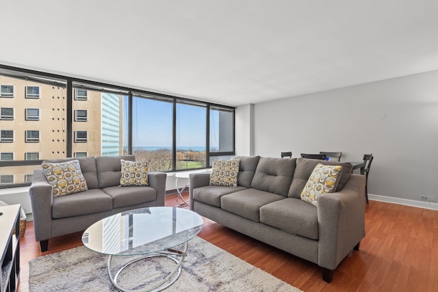 living area with wood finished floors and baseboards