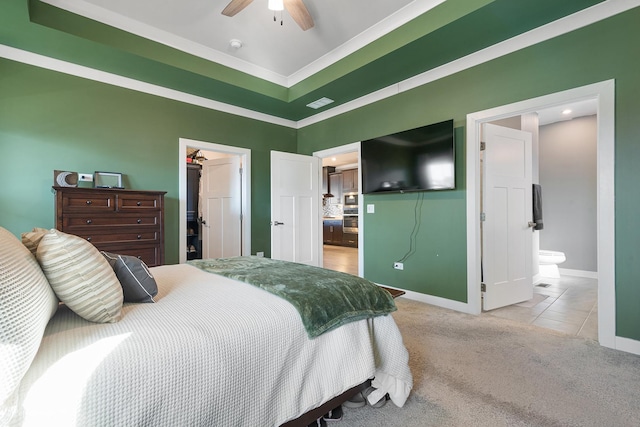 bedroom with a walk in closet, ensuite bath, a closet, carpet floors, and baseboards