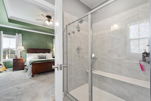 bathroom with connected bathroom, a stall shower, crown molding, and a ceiling fan