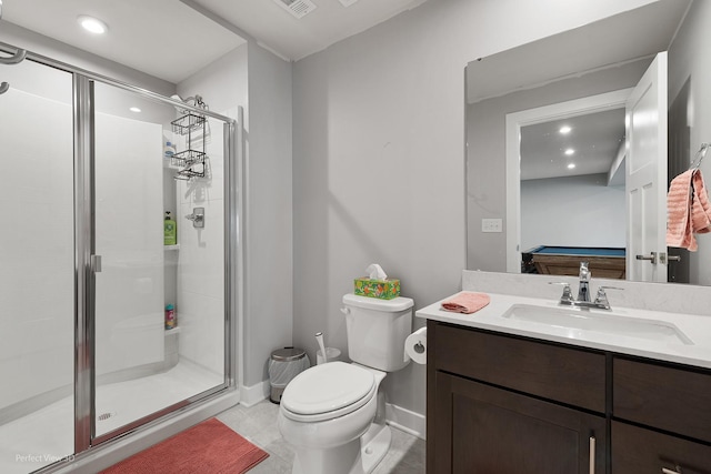 full bathroom featuring vanity, a shower stall, toilet, and baseboards