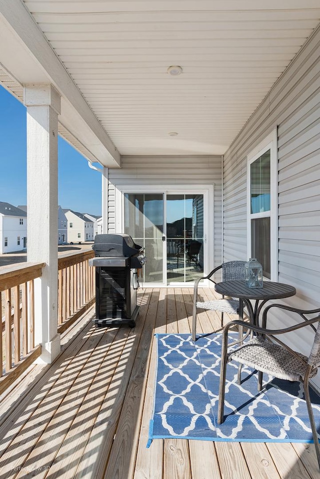 wooden deck featuring grilling area