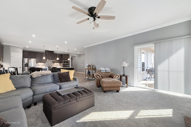 living room featuring crown molding, recessed lighting, baseboards, and ceiling fan