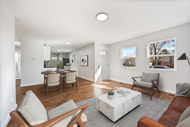 living area featuring wood finished floors and baseboards