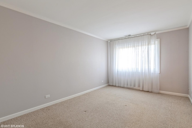 empty room featuring visible vents, light carpet, baseboards, and crown molding