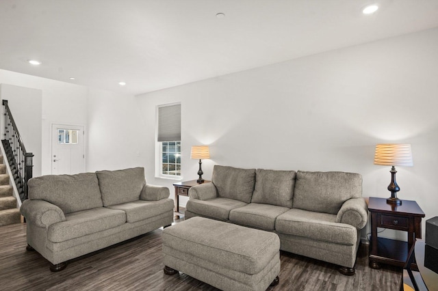living area with stairway, recessed lighting, and dark wood-style flooring
