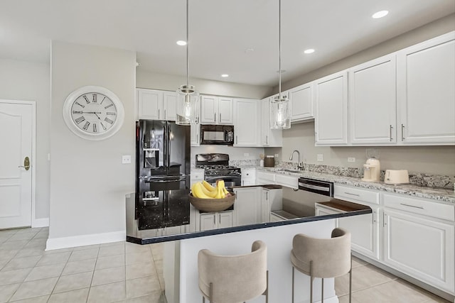 kitchen with light tile patterned flooring, recessed lighting, a sink, black appliances, and white cabinetry