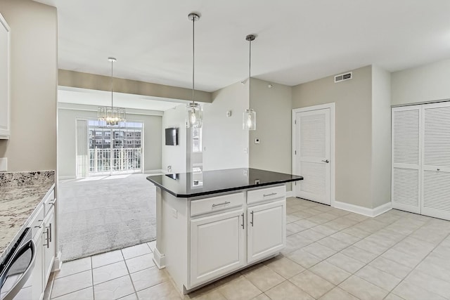 kitchen featuring visible vents, stainless steel dishwasher, open floor plan, white cabinetry, and a chandelier