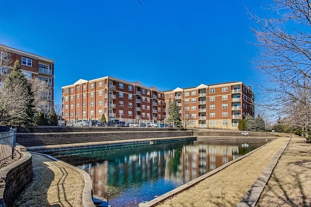 view of pool with a water view