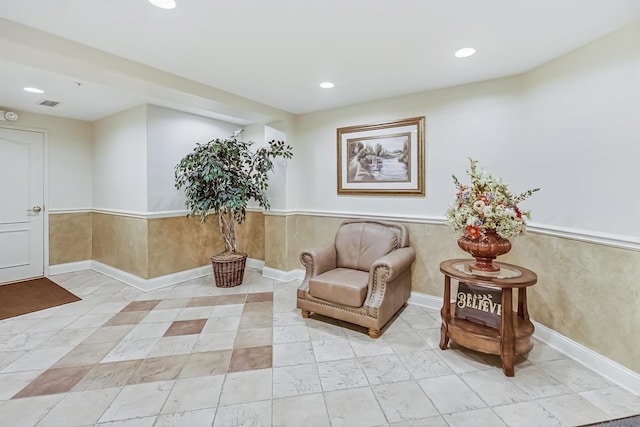 living area with recessed lighting and visible vents