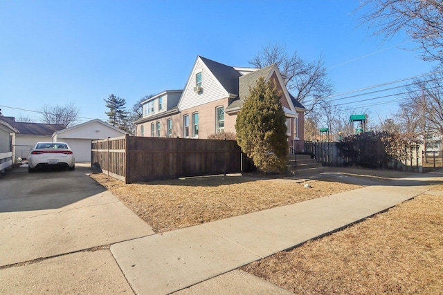 view of side of home with fence