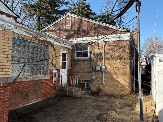 back of house featuring entry steps