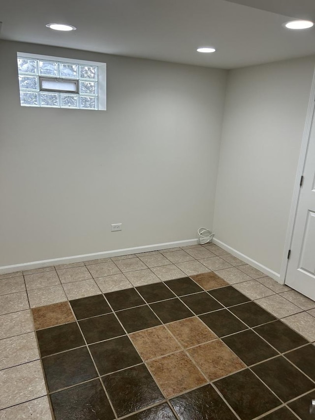 interior space with baseboards, tile patterned flooring, and recessed lighting