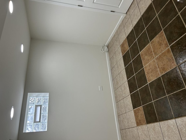 bathroom with tiled shower