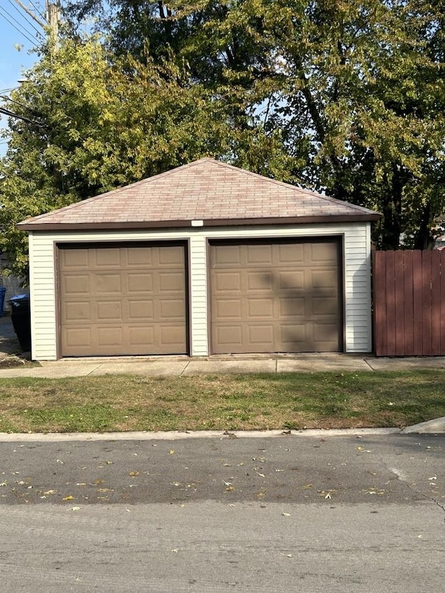 detached garage with fence