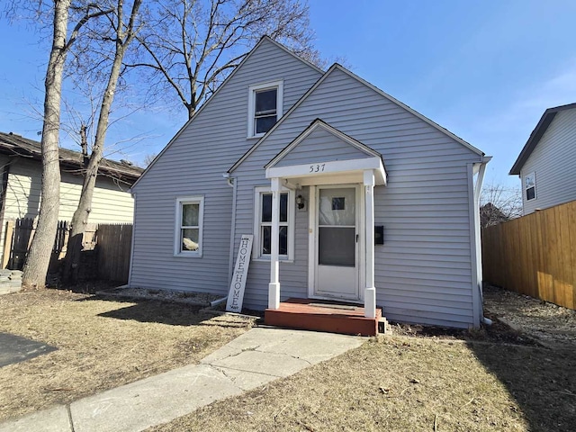 view of front of home featuring fence