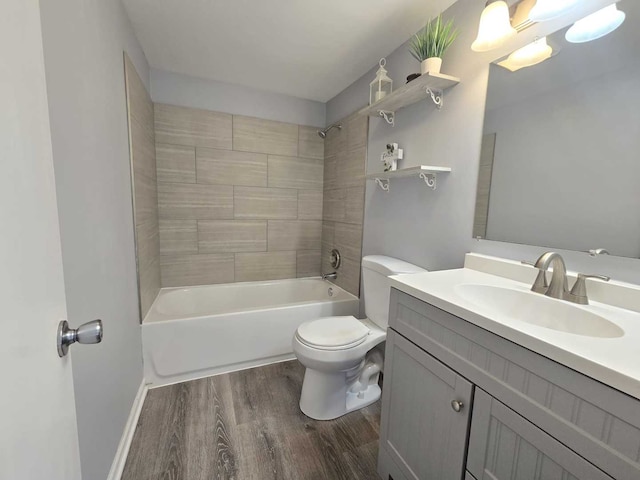 full bathroom with vanity, toilet, wood finished floors, and tub / shower combination