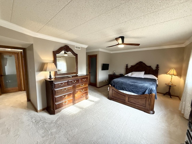 bedroom featuring light colored carpet, visible vents, and ornamental molding