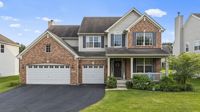 view of front of home featuring aphalt driveway, a garage, covered porch, and brick siding