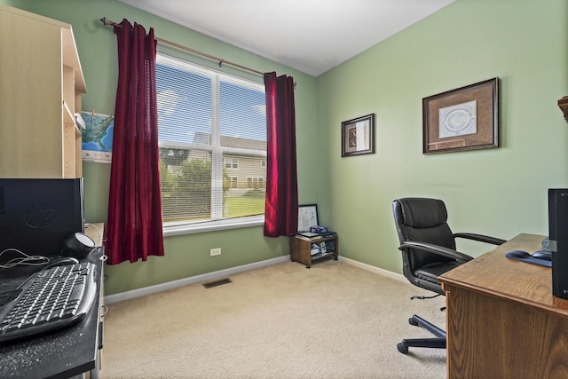 carpeted home office with visible vents and baseboards