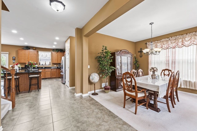 dining area featuring recessed lighting, a notable chandelier, light tile patterned flooring, and baseboards