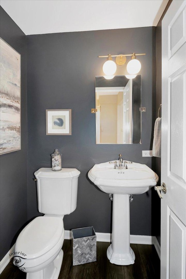 27W213 Manchester Rd, Winfield, IL 60190 - half bathroom featuring toilet, baseboards, and wood finished floors