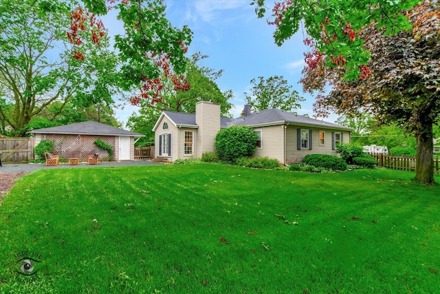 27W213 Manchester Rd, Winfield, IL 60190 - single story home with a chimney and a garage