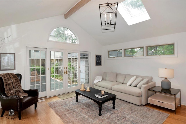 27W213 Manchester Rd, Winfield, IL 60190 - living area with french doors, a skylight, wood finished floors, high vaulted ceiling, and beam ceiling