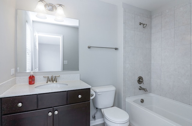 bathroom with toilet, vanity, and washtub / shower combination