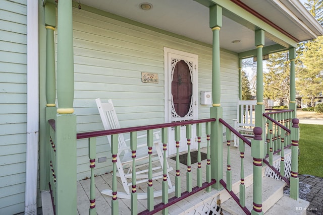 view of exterior entry featuring a porch