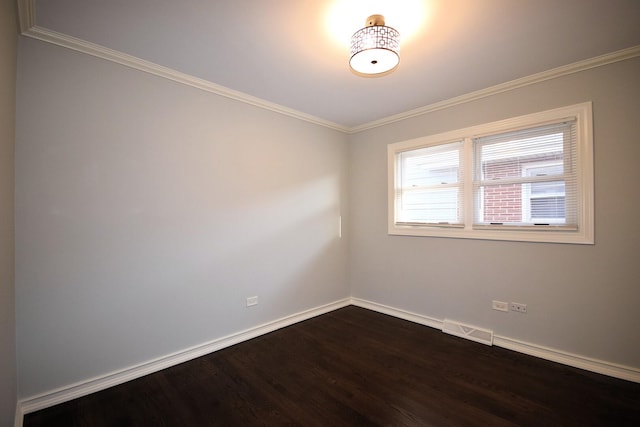 unfurnished room with visible vents, crown molding, baseboards, and dark wood-style flooring