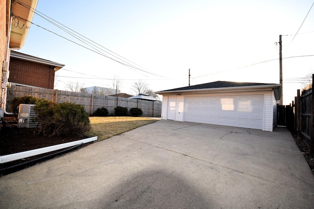 detached garage with cooling unit and fence