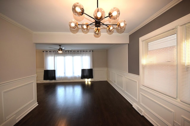 unfurnished room featuring a wainscoted wall, visible vents, dark wood-style flooring, and ornamental molding