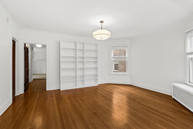 interior space featuring crown molding, radiator, wood finished floors, and baseboards