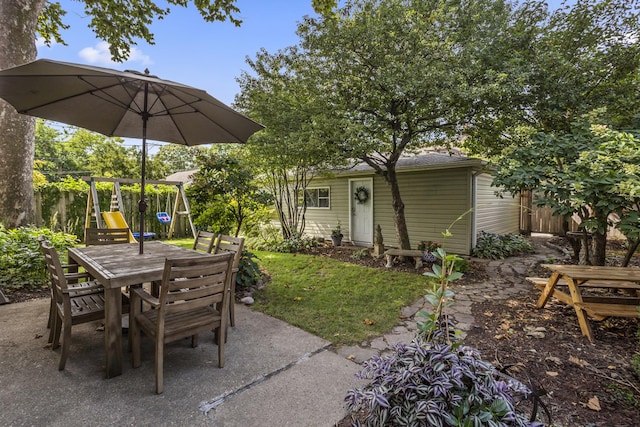 view of patio with outdoor dining area and fence