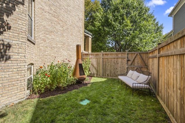 view of yard with a fenced backyard