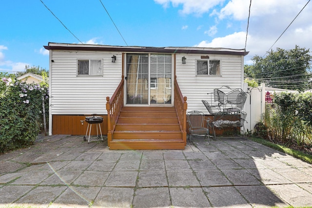 11551 S Justine St, Chicago, IL 60643 - rear view of property with entry steps and a patio