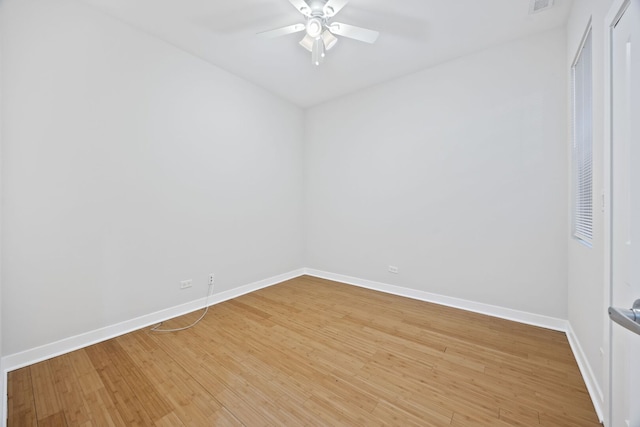 unfurnished room with visible vents, light wood-style flooring, baseboards, and ceiling fan