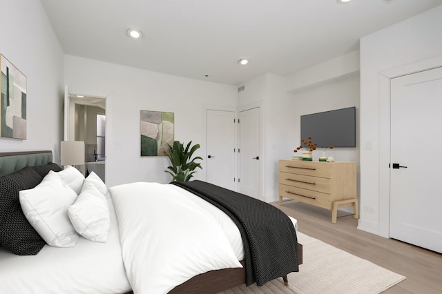 bedroom with recessed lighting, light wood-style flooring, and visible vents