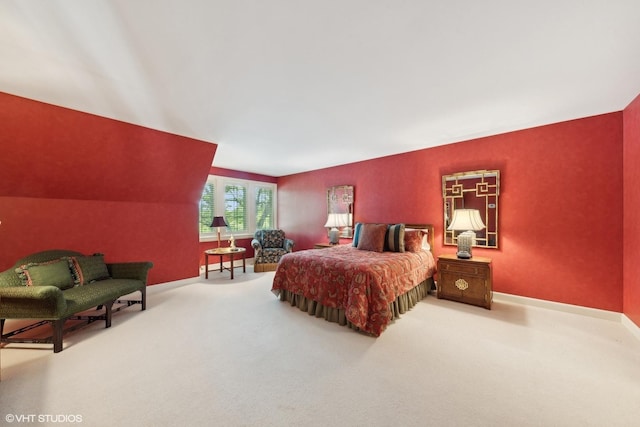 carpeted bedroom featuring baseboards