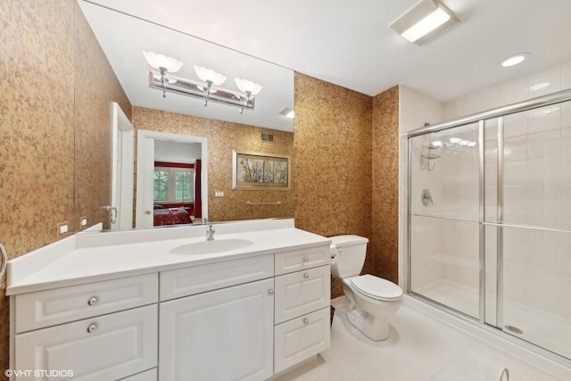 bathroom featuring wallpapered walls, a shower stall, toilet, and vanity