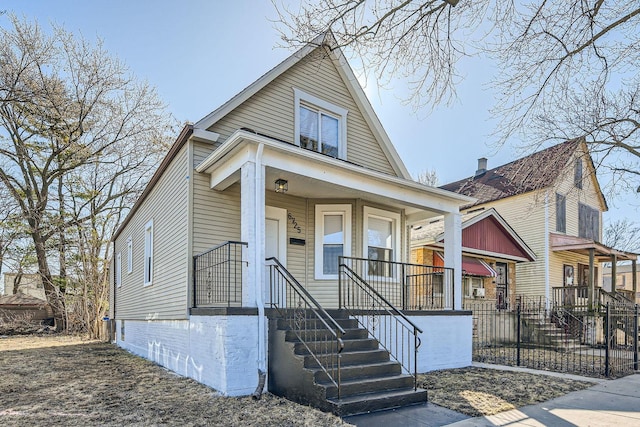 view of front of house with covered porch and fence