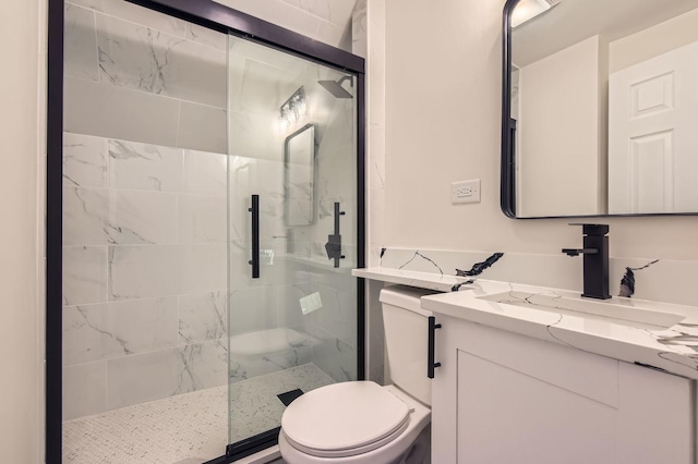 full bathroom with a stall shower, toilet, and vanity