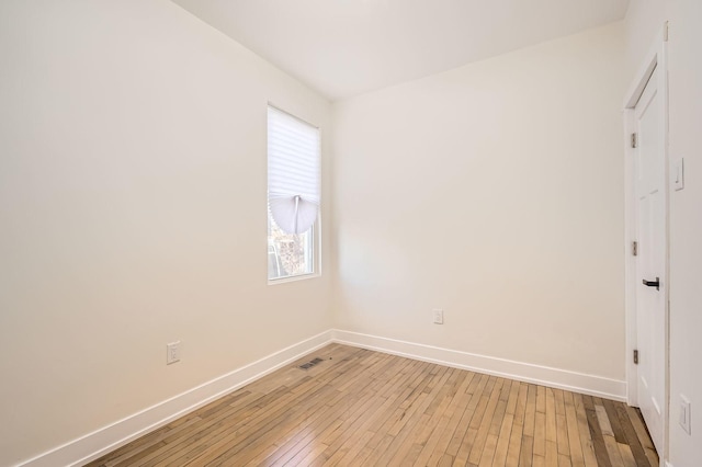 unfurnished room with visible vents, baseboards, and light wood-style flooring