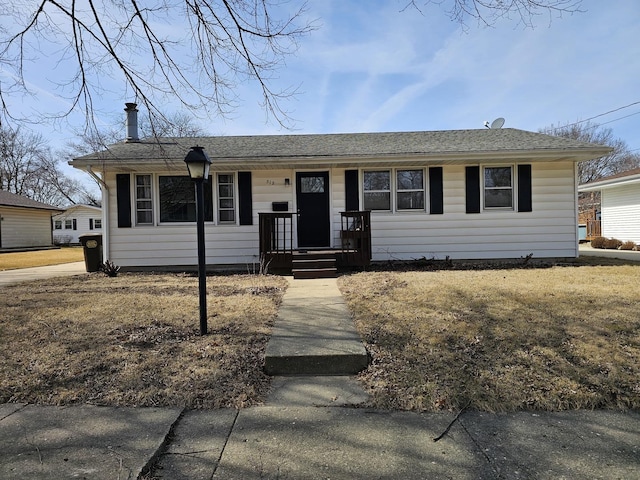 view of front of property featuring roof with shingles and covered porch