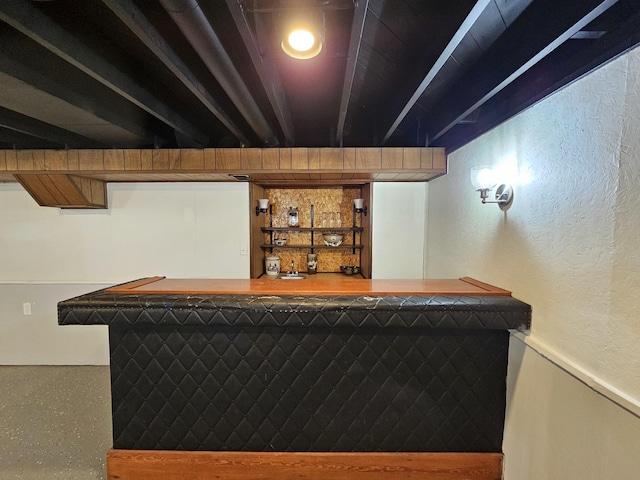 bar with a bar and a textured wall