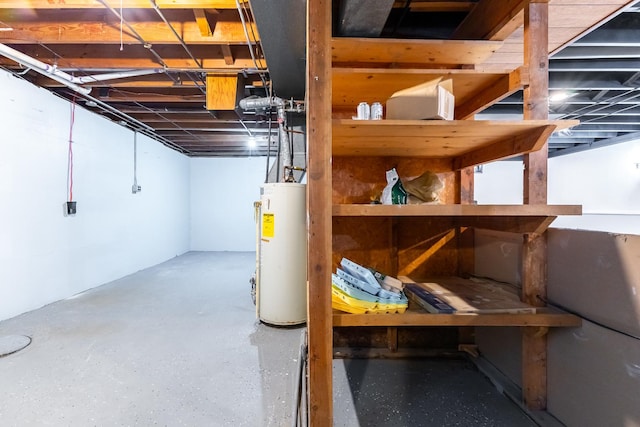 unfinished basement featuring gas water heater